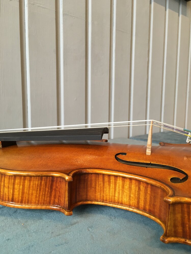 Clean rosin from violin strings